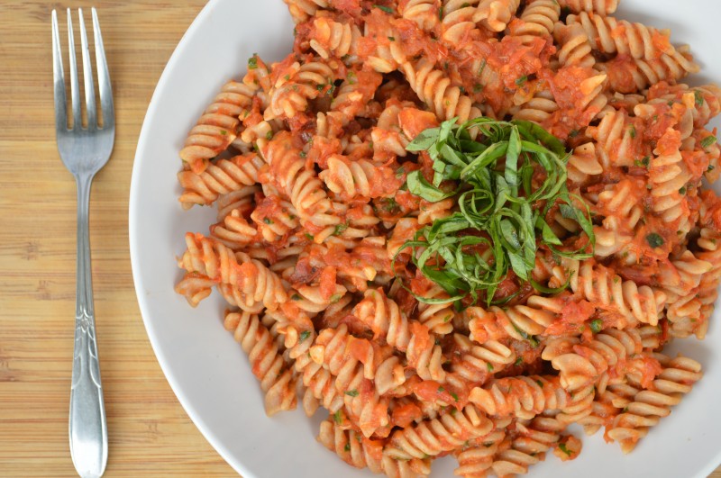 Sprouts and Chocolate: Slow Roasted Tomato and Garlic Pasta Sauce. Slow roasting tomatoes brings out their natural sweetness and when made into a sauce, it is a heavenly combination. Takes a little while but it is entirely worth the effort. You may find yourself just eating them straight off the pan.