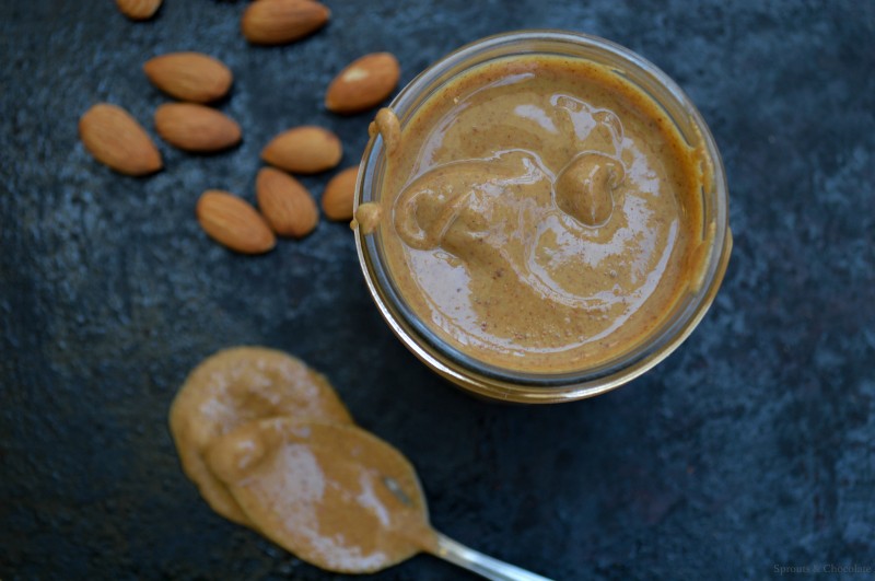 Sprouts & Chocolate: One Ingredient Roasted Almond Butter Recipe. This almond butter is so simple to make! It tastes better and is less expensive than store bought, not to mention the added bonus of no preservatives, gums or added oils in this homemade version. Smooth, creamy and insanely addictive! You will find more and more uses for almond butter with each spoonful.