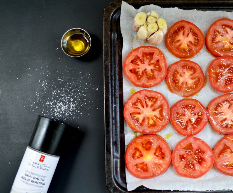 Sprouts and Chocolate: Slow Roasted Tomato and Garlic Pasta Sauce. Slow roasting tomatoes brings out their natural sweetness and when made into a sauce, it is a heavenly combination. Takes a little while but it is entirely worth the effort. You may find yourself just eating them straight off the pan.