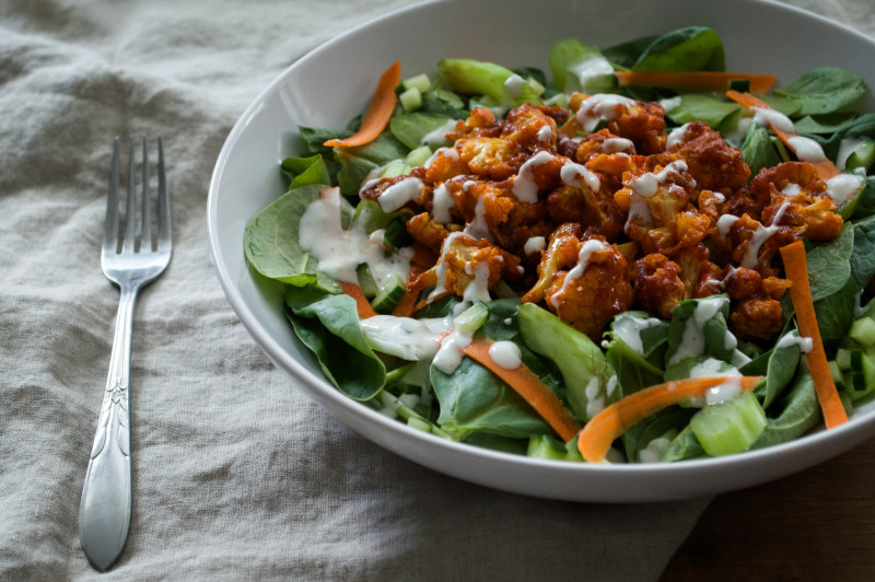 baked vegan gluten free buffalo cauliflower salad with creamy garlic dressing recipe